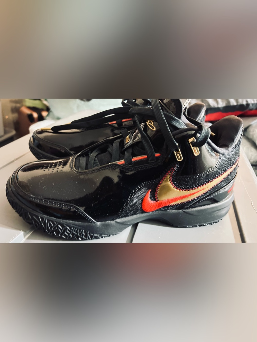 Nike Black Patent Leather Sneakers with Red & Gold Swoosh Accent